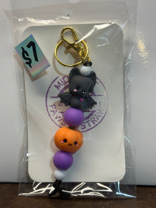 Purple bat and pumpkin